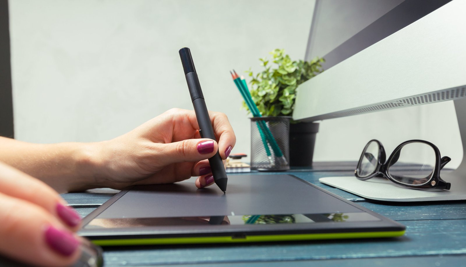 hand of graphic designer working with stilus and tablet